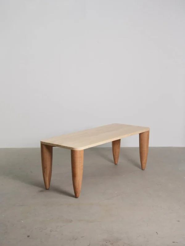 Travertine-Top Elephant-Leg Table in Ash — in a room setting
