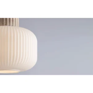 Travertine Cap Ribbed Milk Glass Cylinder Pendant Light in ivory — in a room setting