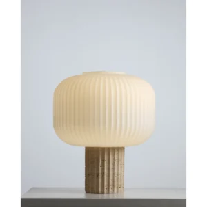 Travertine Column Table Lamp with Ribbed Opal Globe Shade in oatmeal — in a room setting