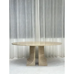 Travertine Round Dining Table on Stepped Arch Base in oatmeal — in a room setting