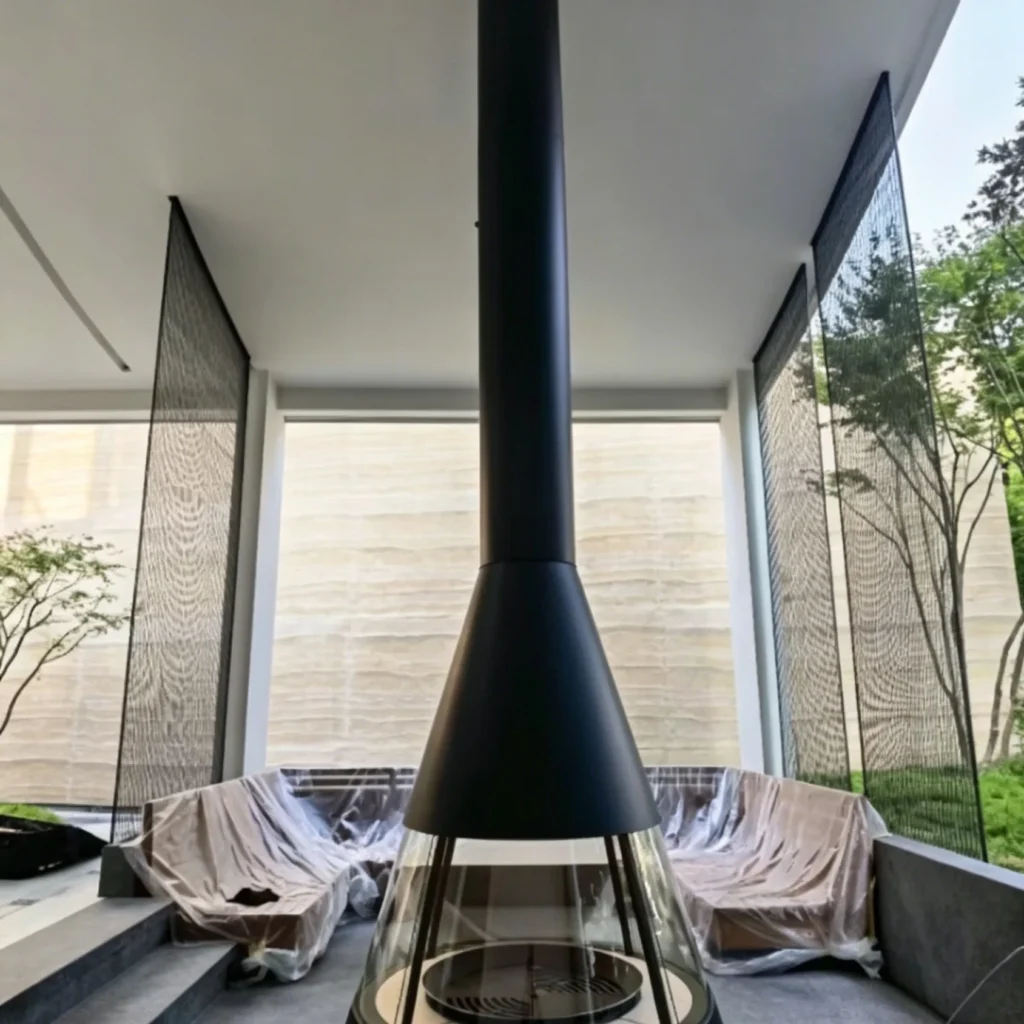 Trumpet Hood Floor-Standing Wood-Burning Fireplace in black — front view