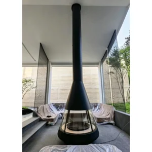 Trumpet Hood Floor-Standing Wood-Burning Fireplace in black — in a room setting