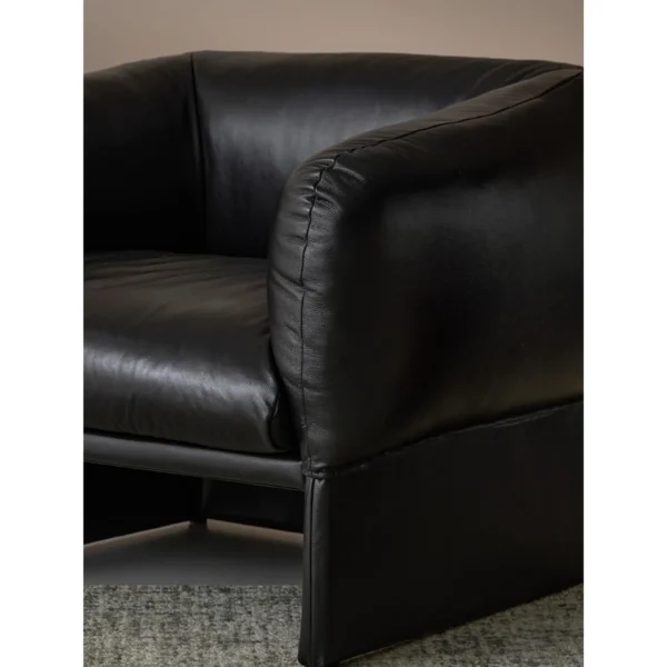 Tulip Black Leather Armchair with Goose Down Cushions in black — in a room setting