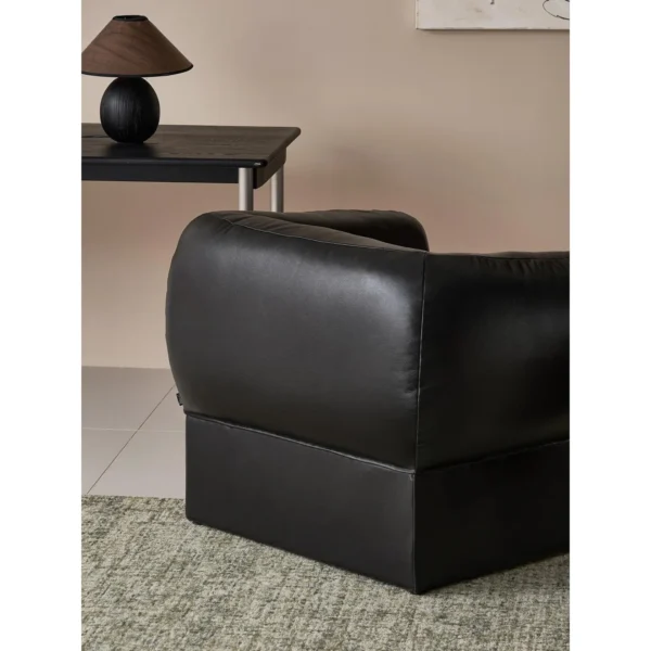 Tulip Black Leather Armchair with Goose Down Cushions in black — in a room setting