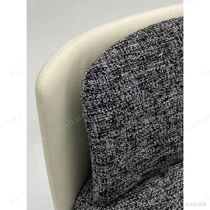 Tweed and Leather Armless Lounge Chair in black — in a room setting