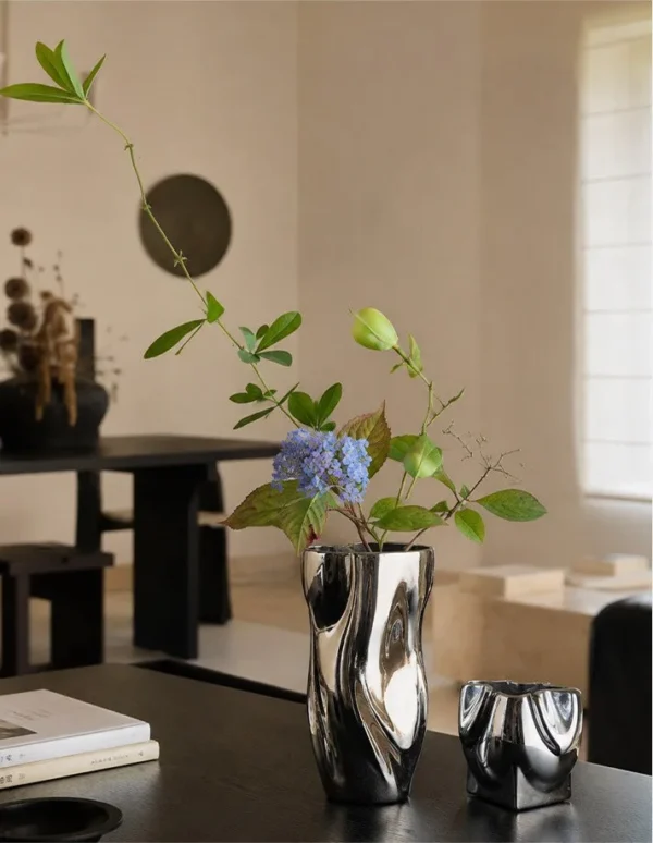 Twisted Pleated Silver-Plated Ceramic Vases, Wave and Pocket in silver — in a room setting