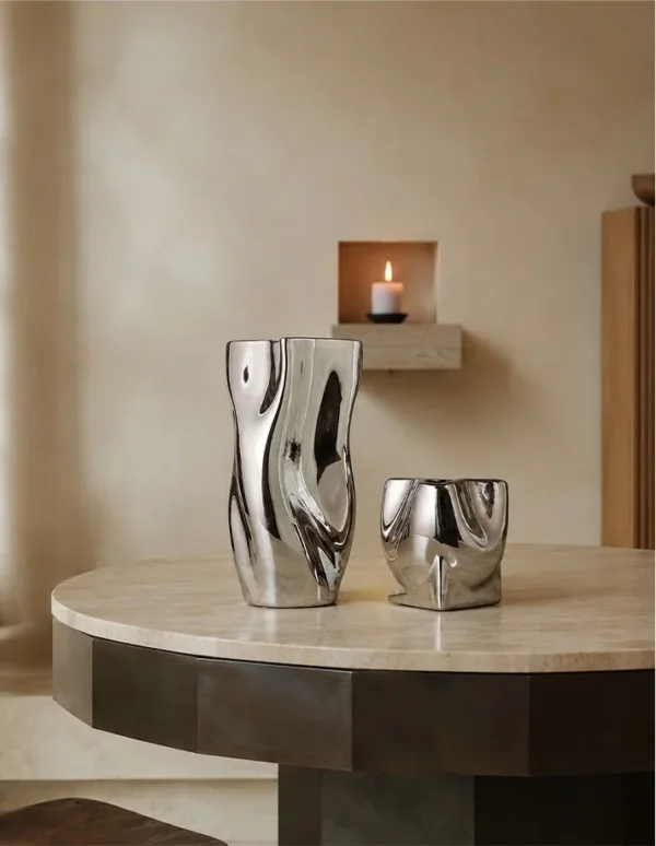 Twisted Pleated Silver-Plated Ceramic Vases, Wave and Pocket in silver — in a room setting