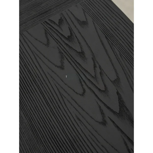 Ubud Black Wood Bench with Crossed Legs in black — in a room setting