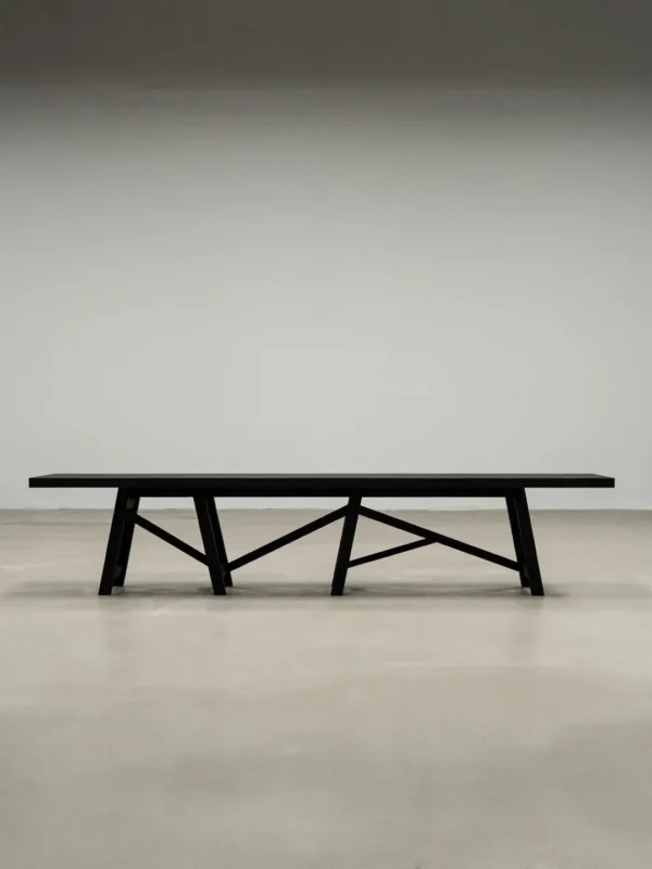 Ubud Black Solid Wood Long Bench in black — in a room setting