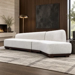 Understated Curved Sofa in Cream Textured Fabric on Dark Wood Base — front view