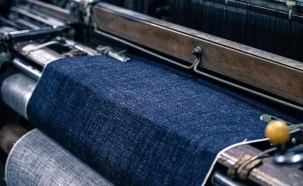 Selvedge Denim Armchair with Wraparound Arms in blue — in a room setting