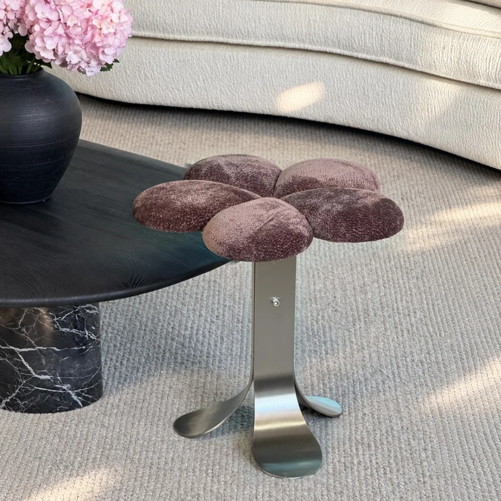 Petal Upholstered Stool on Curved Stainless-Steel Base in rose stone — front view