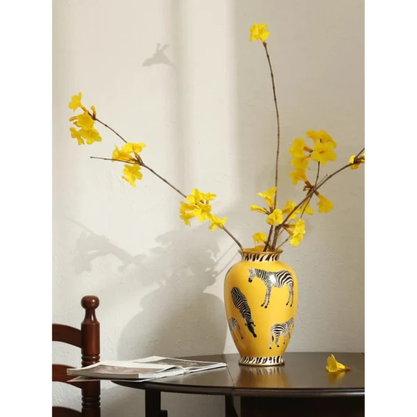 Yellow Ceramic Vase with Painted Zebras and Wide Mouth in mustard — in a room setting