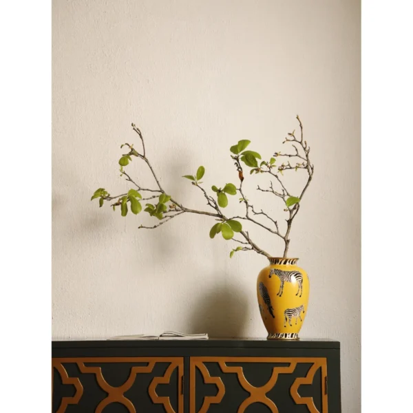 Yellow Ceramic Vase with Painted Zebras and Wide Mouth in mustard — in a room setting