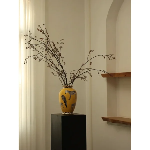 Yellow Ceramic Vase with Painted Zebras and Wide Mouth in mustard — in a room setting