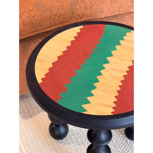 Vintage Marquetry Side Table on Black Turned Gourd Legs in black — in a room setting