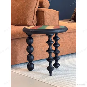 Vintage Marquetry Side Table on Black Turned Gourd Legs in black — in a room setting