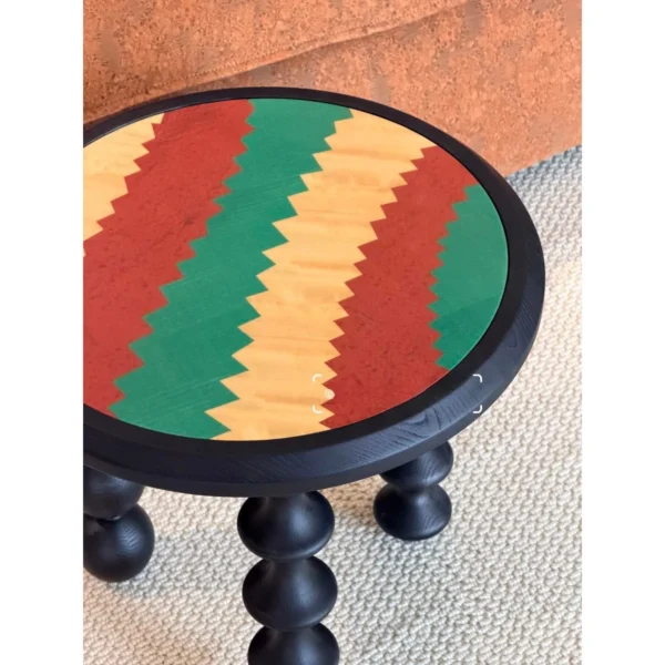 Vintage Marquetry Side Table on Black Turned Gourd Legs in black — in a room setting