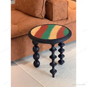 Vintage Marquetry Side Table on Black Turned Gourd Legs in black — in a room setting