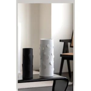 White Cylinder Ceramic Vase in ivory — in a room setting