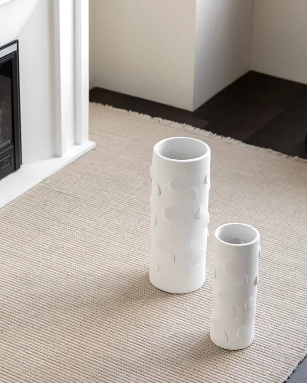 White Cylinder Ceramic Vase in ivory — in a room setting