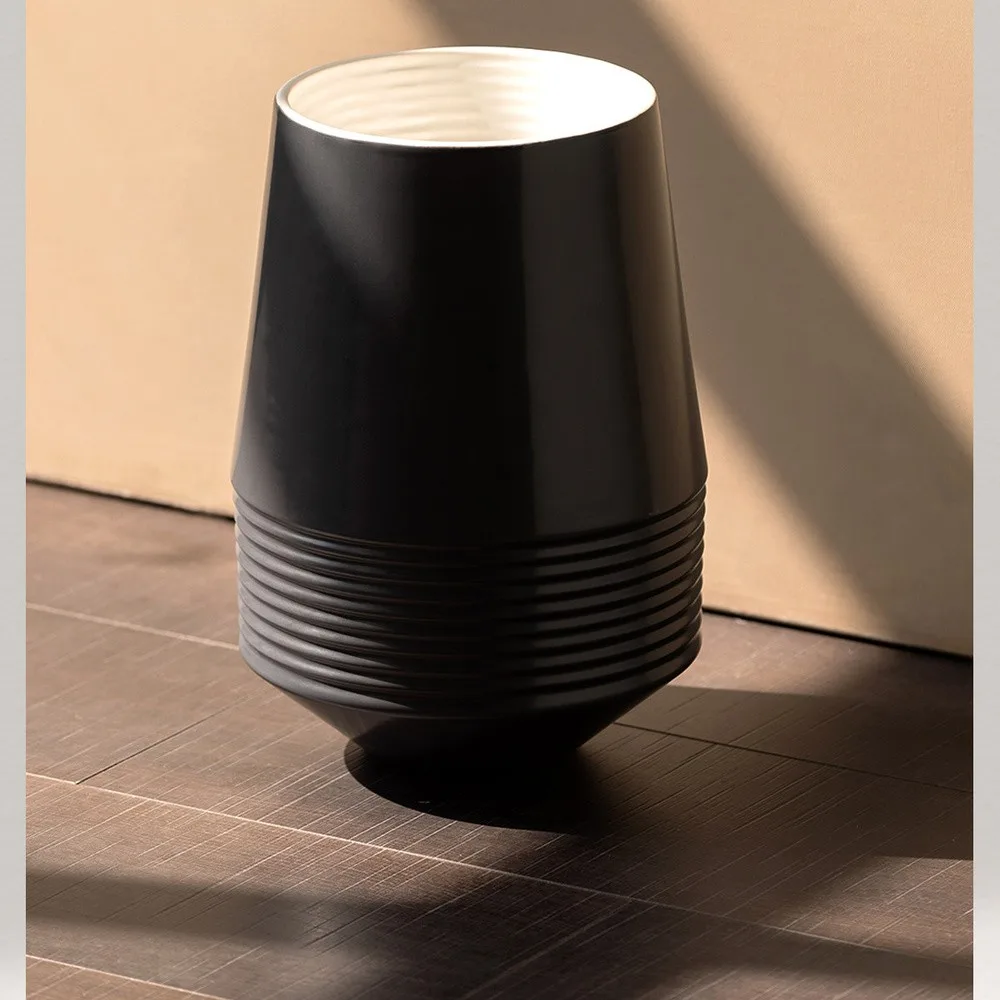 Black Ribbed Cone Ceramic Vase with White Interior in black — front view