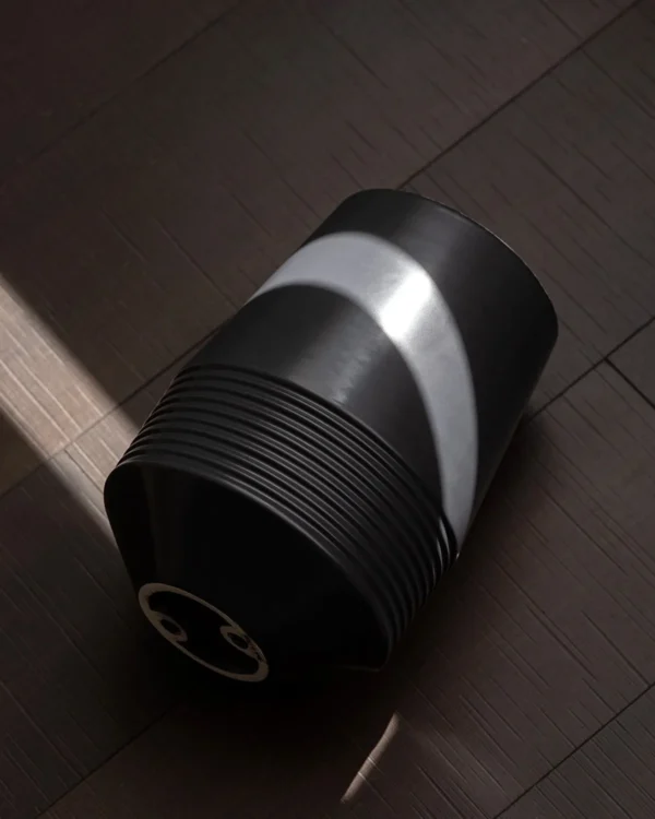 Black Ribbed Cone Ceramic Vase with White Interior in black — in a room setting