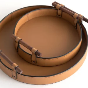 Round Tan Leather Tray in clay — in a room setting