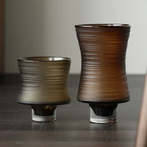 Brown Ribbed Frosted Glass Vase on Dark Foot, Short or Tall in clay — front view
