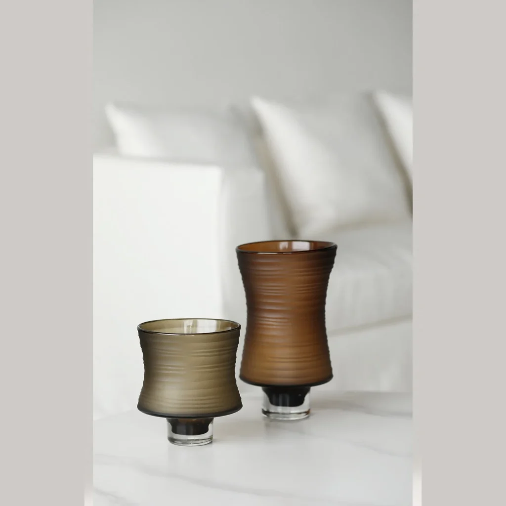 Brown Ribbed Frosted Glass Vase on Dark Foot, Short or Tall in clay — in a room setting