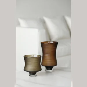 Brown Ribbed Frosted Glass Vase on Dark Foot, Short or Tall in clay — in a room setting