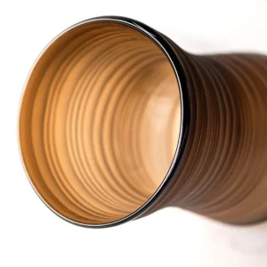 Brown Ribbed Frosted Glass Vase on Dark Foot, Short or Tall in clay — in a room setting