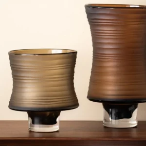 Brown Ribbed Frosted Glass Vase on Dark Foot, Short or Tall in clay — in a room setting