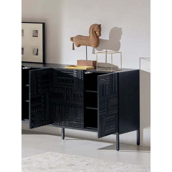 Carved Geometric Sideboard in Black on Steel Base — in a room setting