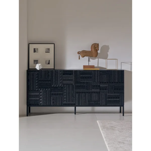 Carved Geometric Sideboard in Black on Steel Base — in a room setting