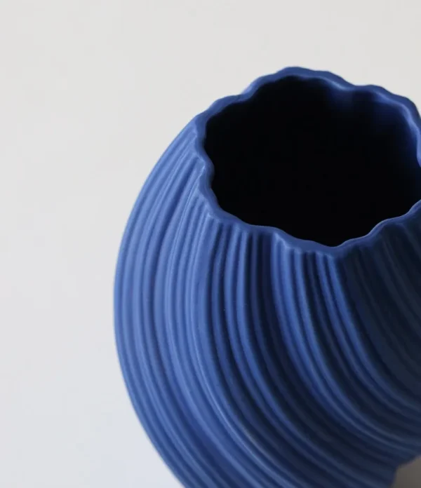 Matte Twisted Rib Ceramic Vase, Three Sizes in sand — in a room setting