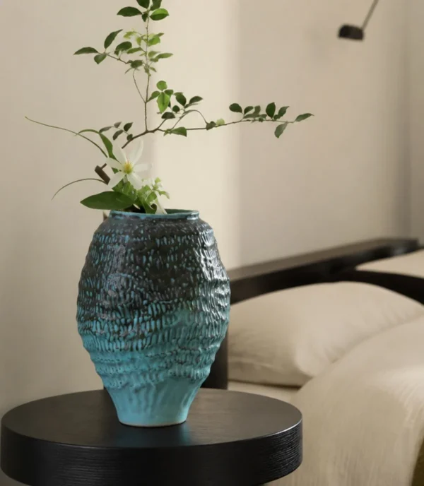 Deep Sea Blue Gradient Pleated Ceramic Vase in blue — in a room setting