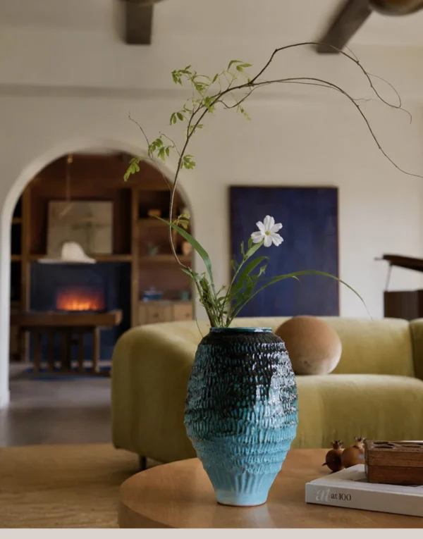 Deep Sea Blue Gradient Pleated Ceramic Vase in blue — in a room setting