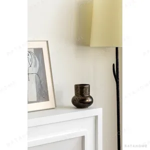 Distressed Bronze-Effect Ceramic Zun Vase in bronze — in a room setting