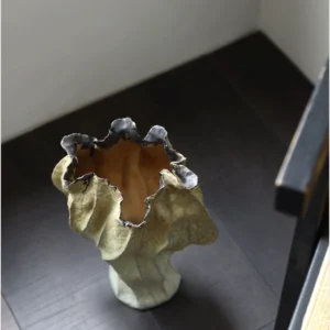 Distressed Pleated Ceramic Vase in Antiqued Olive — in a room setting