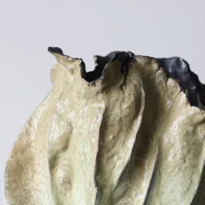 Distressed Pleated Ceramic Vase in Antiqued Olive — in a room setting