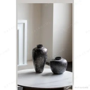 Dust Texture Round-Belly Glass Vase in Bronze, Short or Tall — in a room setting