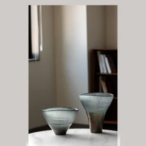 Ribbed Smoked Glass Flared Vases, Tall or Short in slate — in a room setting
