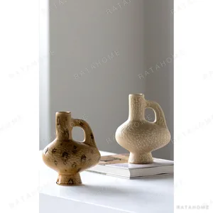 Hand-Made Handled Ewer Vase in Sand Ochre, Two Forms — in a room setting