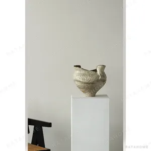 Hand-Built Wild-Grain Textured Ceramic Vase with Torn Rim in oatmeal — in a room setting