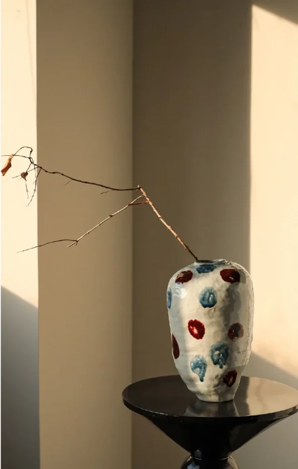 Jingdezhen Glossy White Vase in ivory — in a room setting