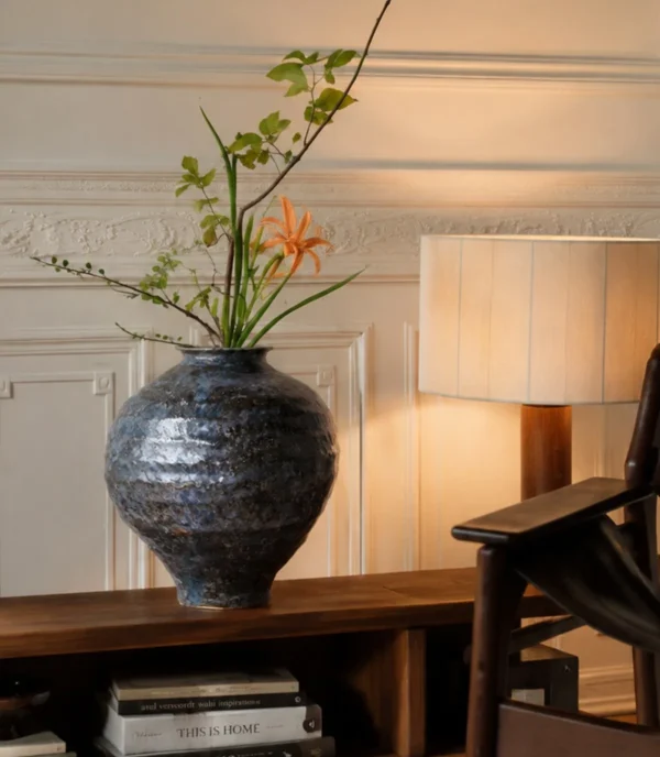 Kiln-Change Mottled Blue-Black Round Jar Vase, Small in black — in a room setting