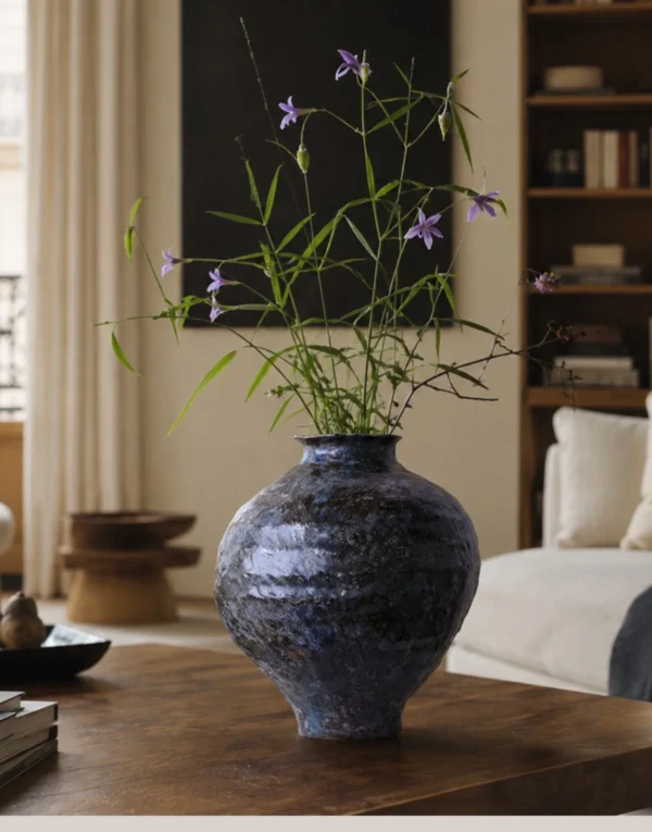 Kiln-Change Mottled Blue-Black Round Jar Vase, Small in black — in a room setting