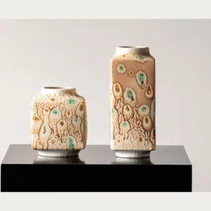 Kiln-Change Speckled Ceramic Vases in sand — front view