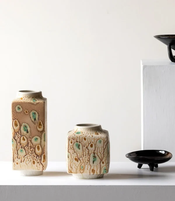 Kiln-Change Speckled Ceramic Vases in sand — in a room setting